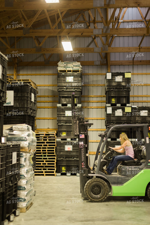 Young Woman Farmer Loads Pallet with Skid Steer 7488