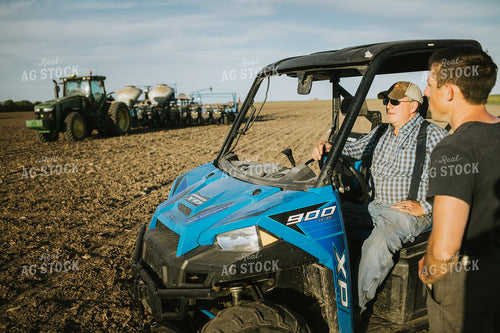 Farmers in Field with UTV and Tractor Planter 4257