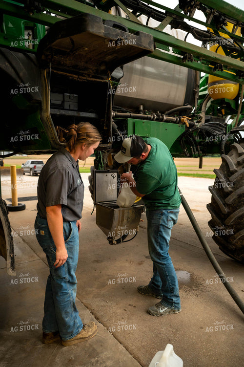 Farmers Filling Self-Propelled Sprayer 115747