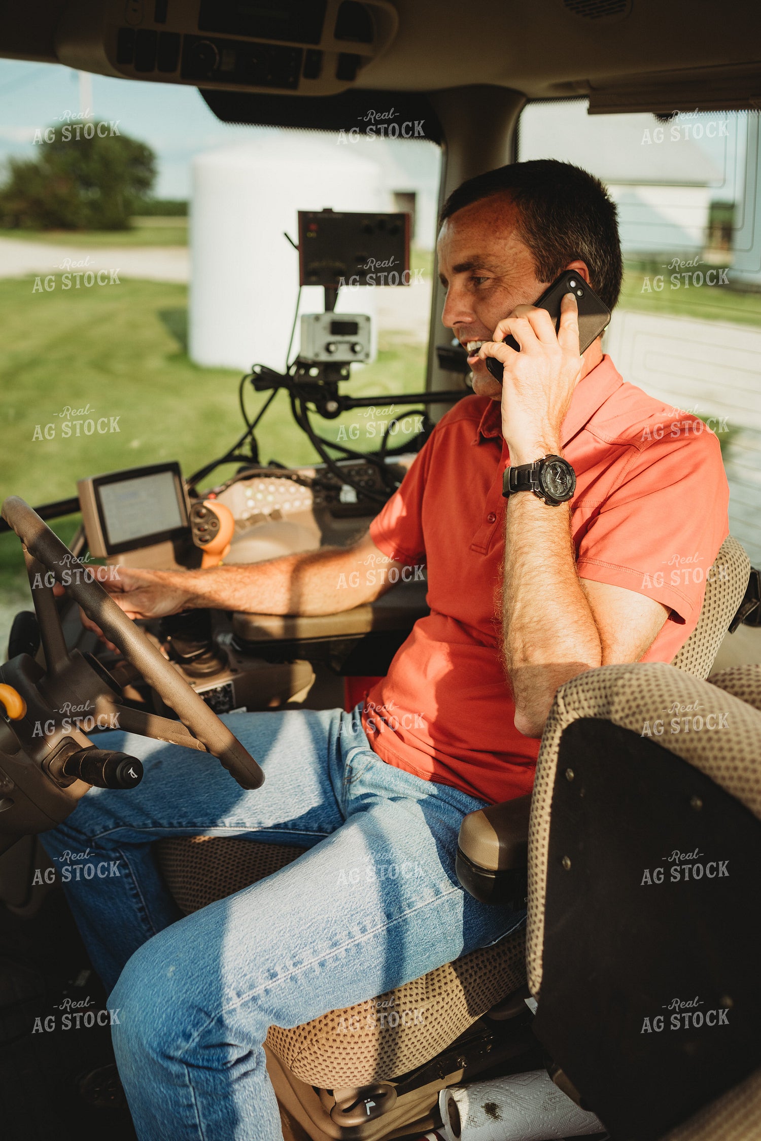 Farmer with Tractor Cab Monitors and Talking on Smart Phone 4468