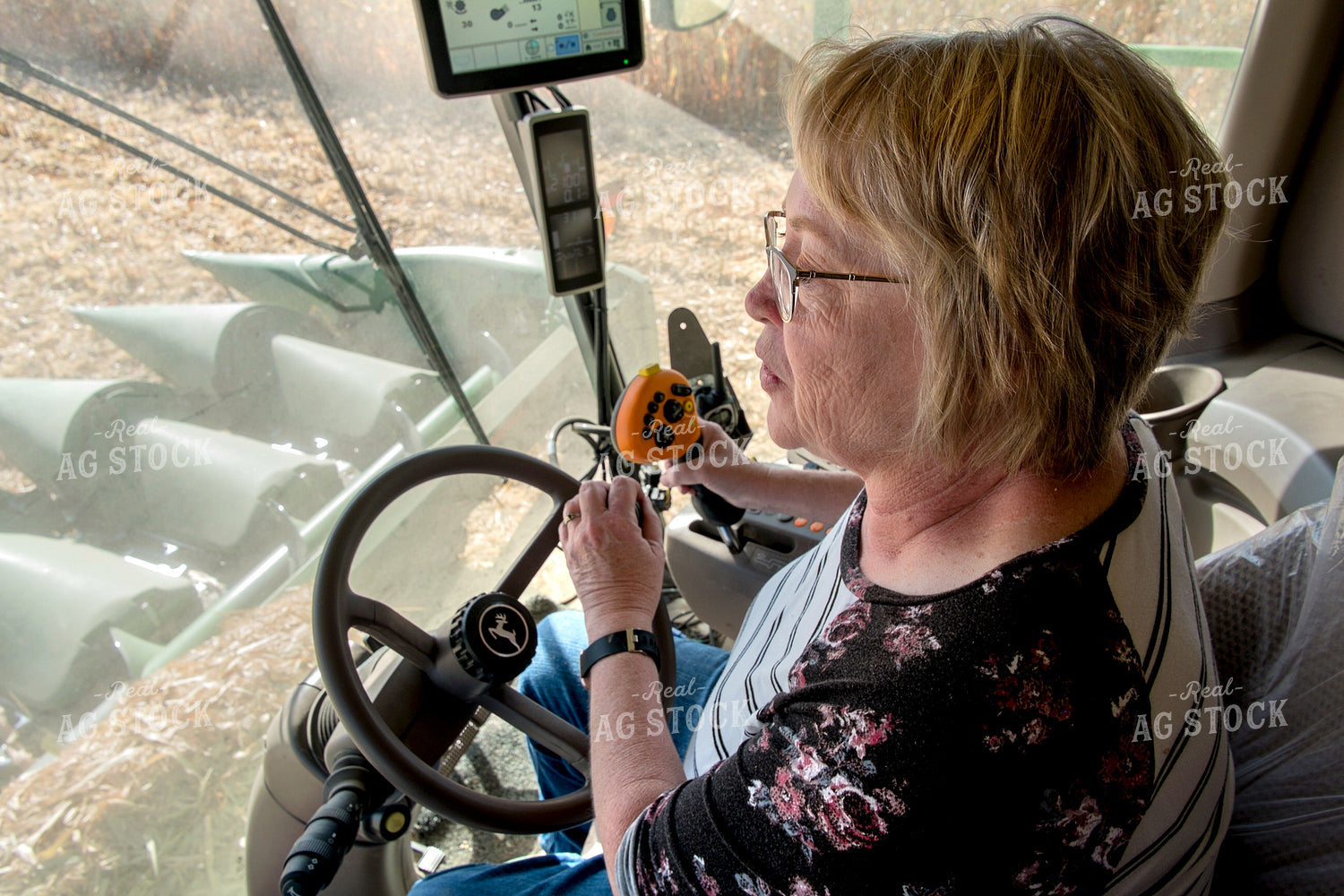 Female Farmer Driving Combine 154027