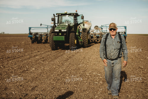 Farmer Walking Away from Tractor and Planter 4188