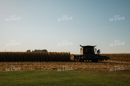 Farmer Lifting Kid into Combine 26045