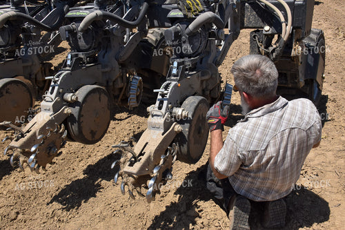 Farmer Adjusting Planter 84054