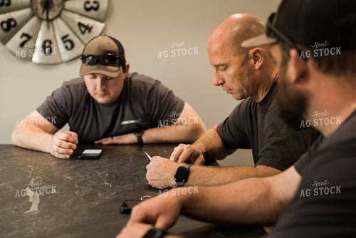 Farmers Review Seed Orders in Farm Office 7617