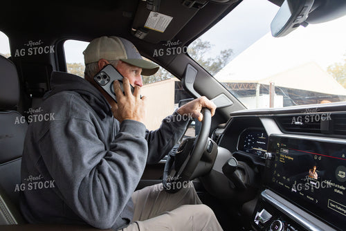 Farmer Talking on Phone in Truck 79748
