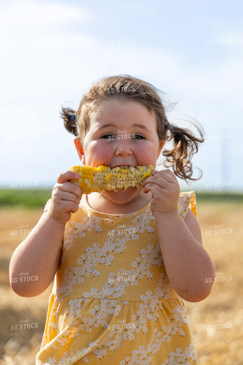 Farm Kid Eating Corn on the Cob 71067