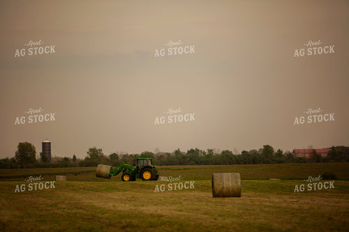 Tractor Lifting Round Hay Bale 5518