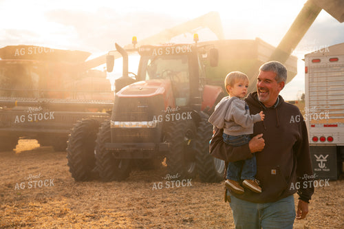 Farmer with Grandson in Bean Field 25680