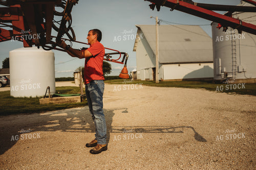 Farmer Checking Sprayer Nozzles 4449
