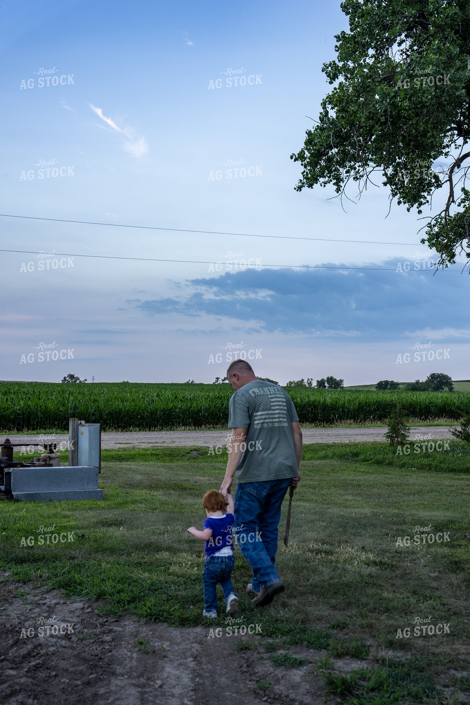 Farmer and Farm Kid Checking Gated Irrigation Pipe 65889