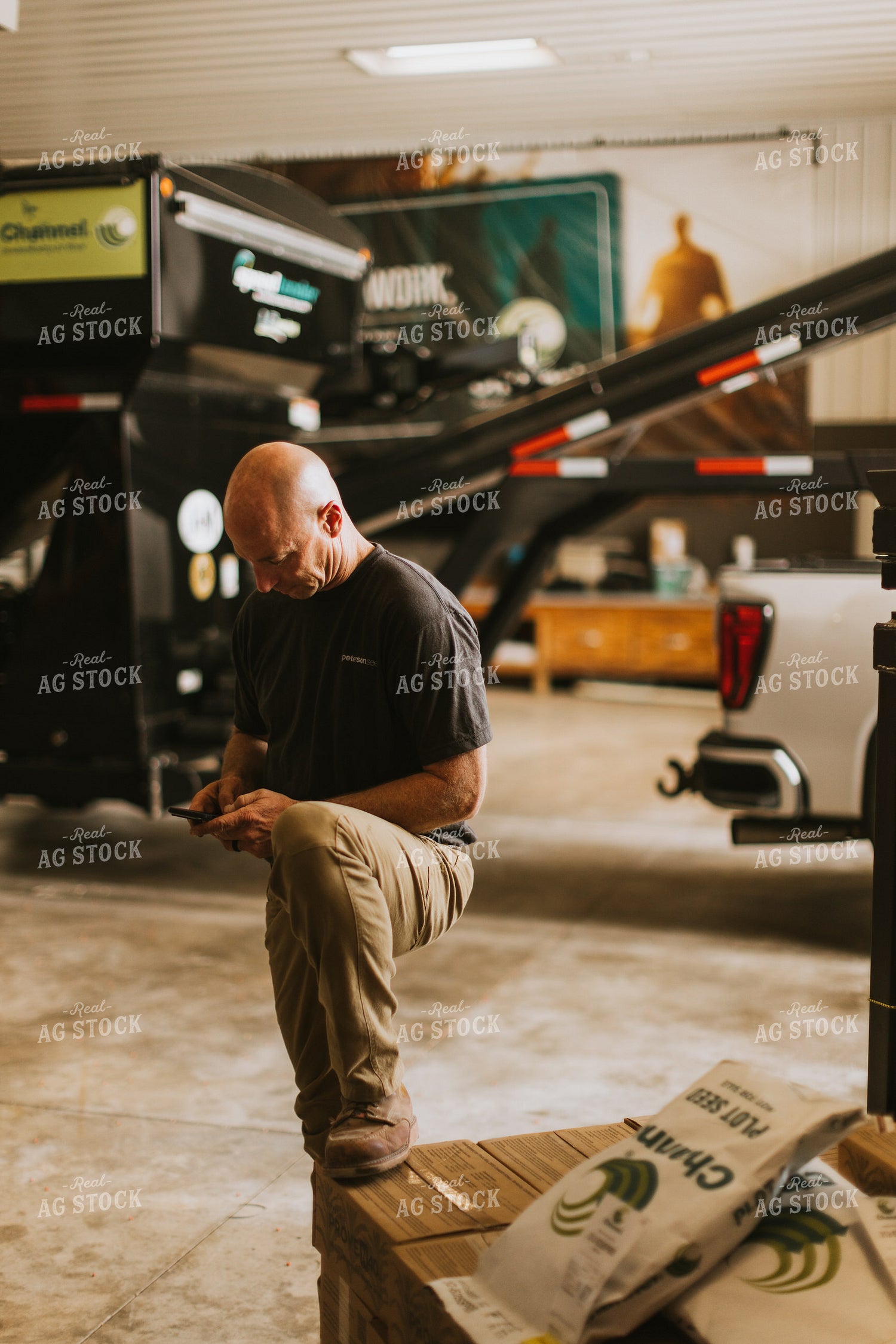 Farmer Uses Phone in Shed 7581