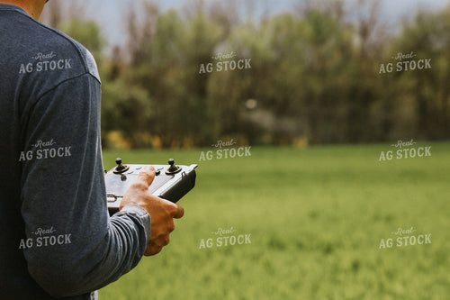 Close Up of Farmer's Hands Flying Drone 101045