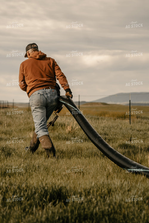 Farmer Working on Irrigation System 58224