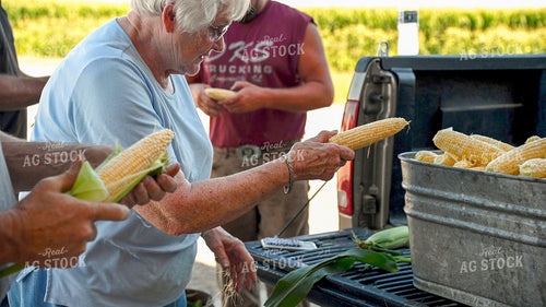 Family Shucking Sweet Corn 25252