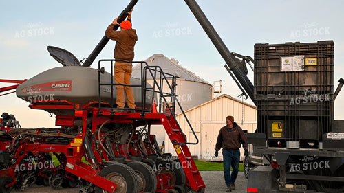 Farmer Climbing into Tractor Cab 25343