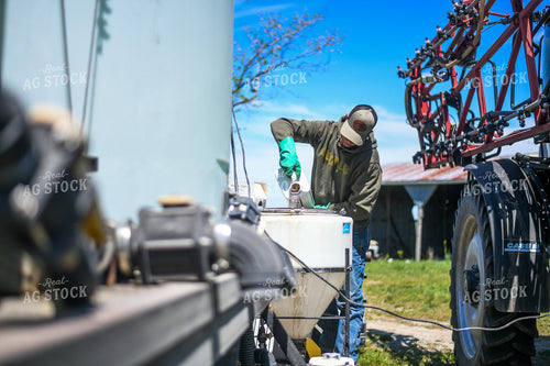 Farmer Mixing Chemicals for Self Propelled Sprayer 191068