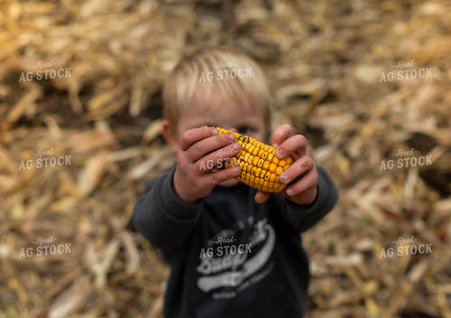 Farm Kid Holding Ear of Corn 185084