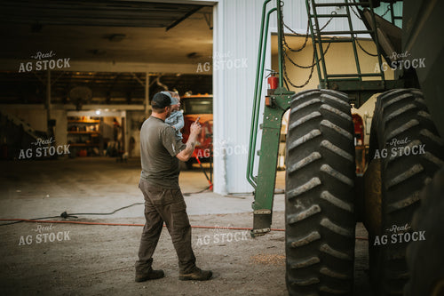 Farmer and Farm Kid Working on Combine 5119