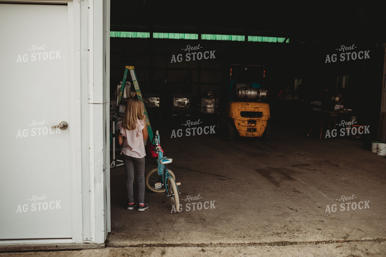 Farm Kid with Bicycle in Shop 4538