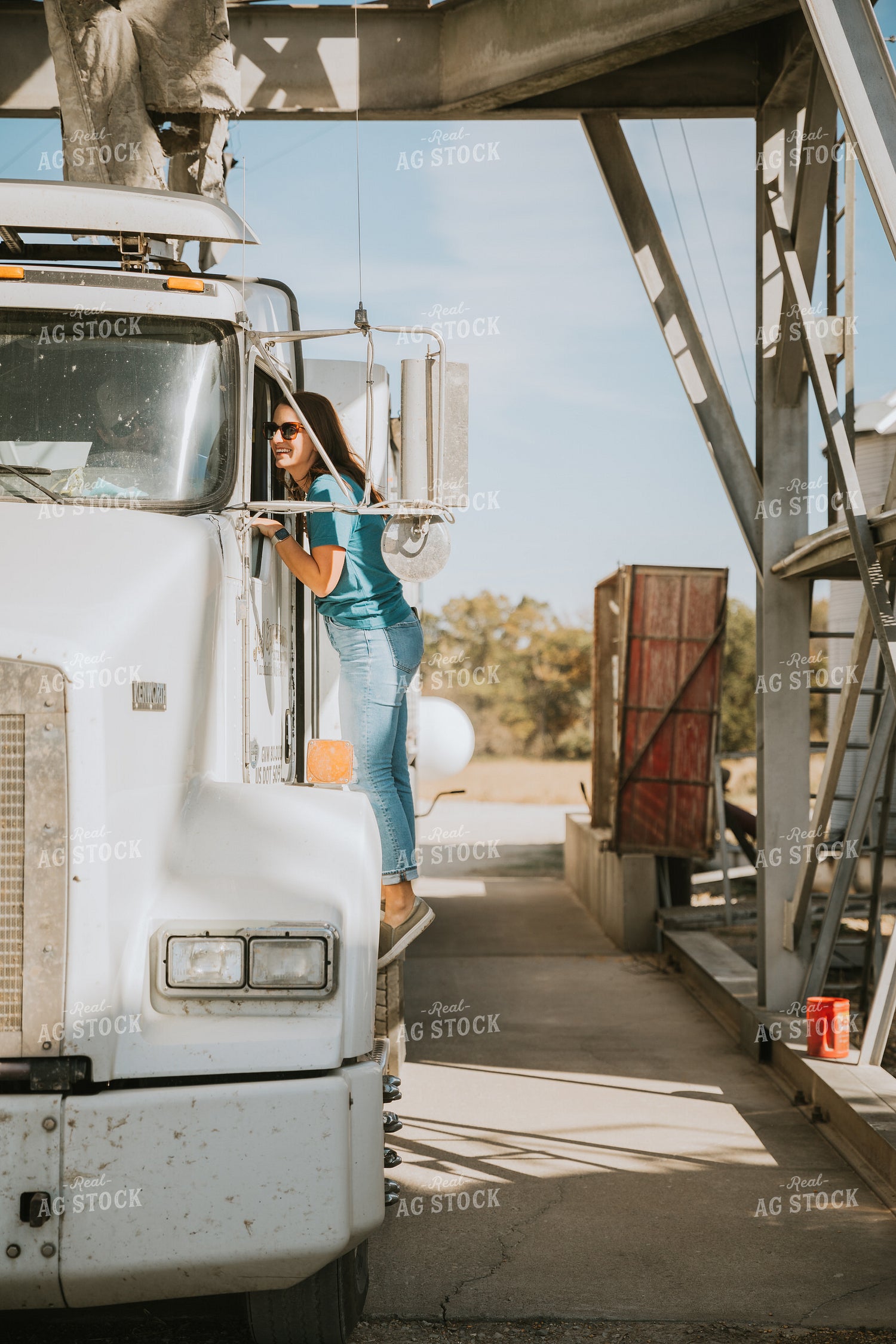 Female Farmer Getting in Semi Cab 7046