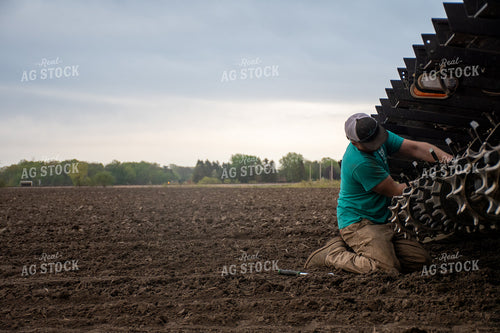 Farmer Working on Equipment 50278