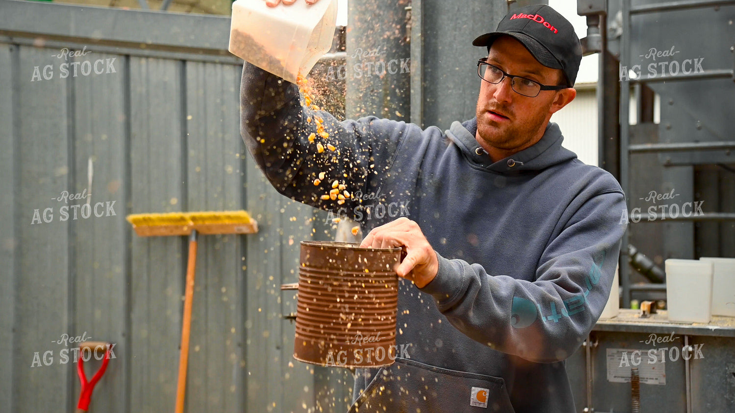 Farmer Testing Corn Moisture On-farm Storage 25626