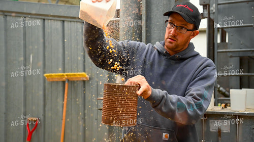 Farmer Testing Corn Moisture On-farm Storage 25626
