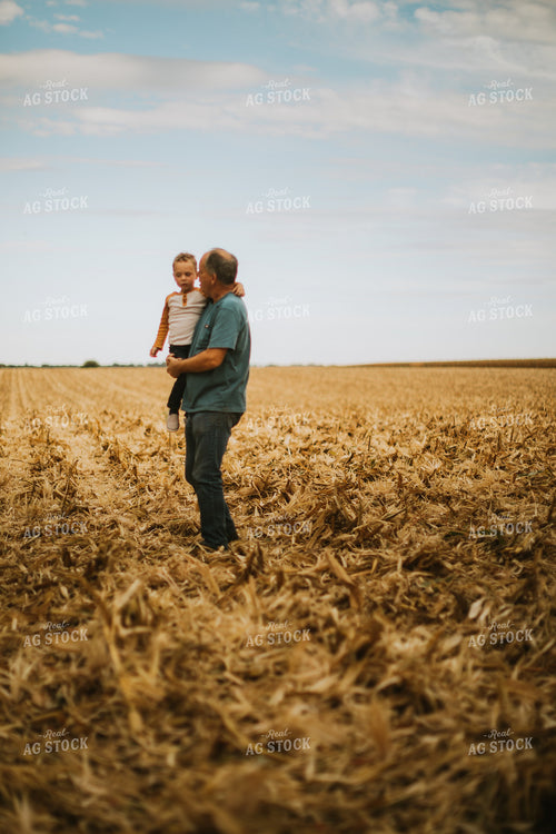 Farmer and Farm Kid in Field 6608