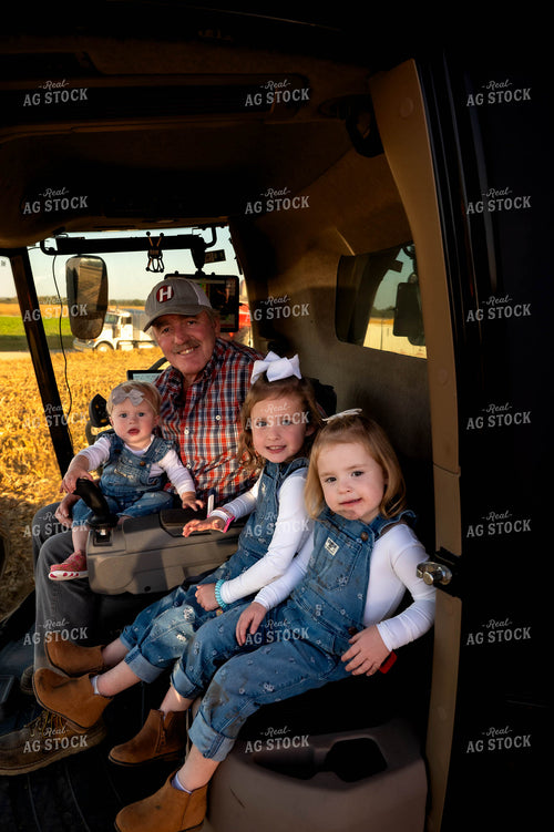 Farmer and Granddaughters in Combine 115552