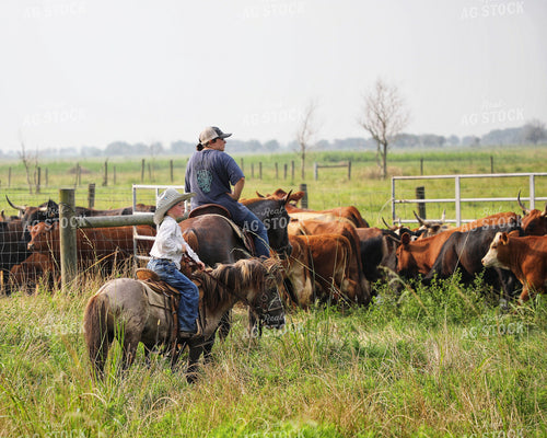 Rancher and Kid on Horseback 210012