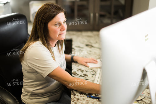 Woman Farmer Works on Computer in Office 7504