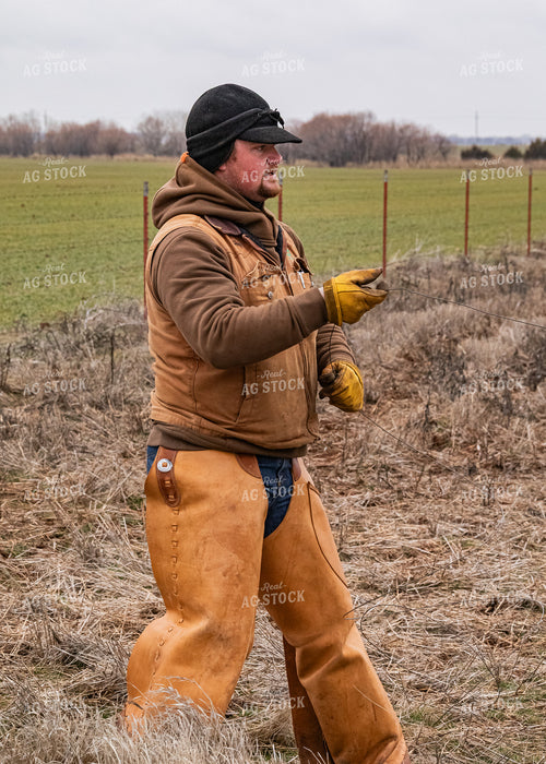 Rancher Fixing Fence 231060