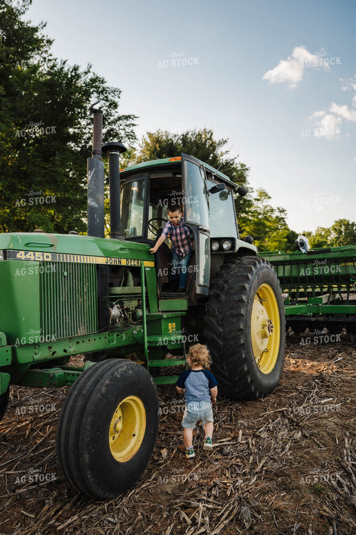 Farm Kids Climbing into Tractor 115203