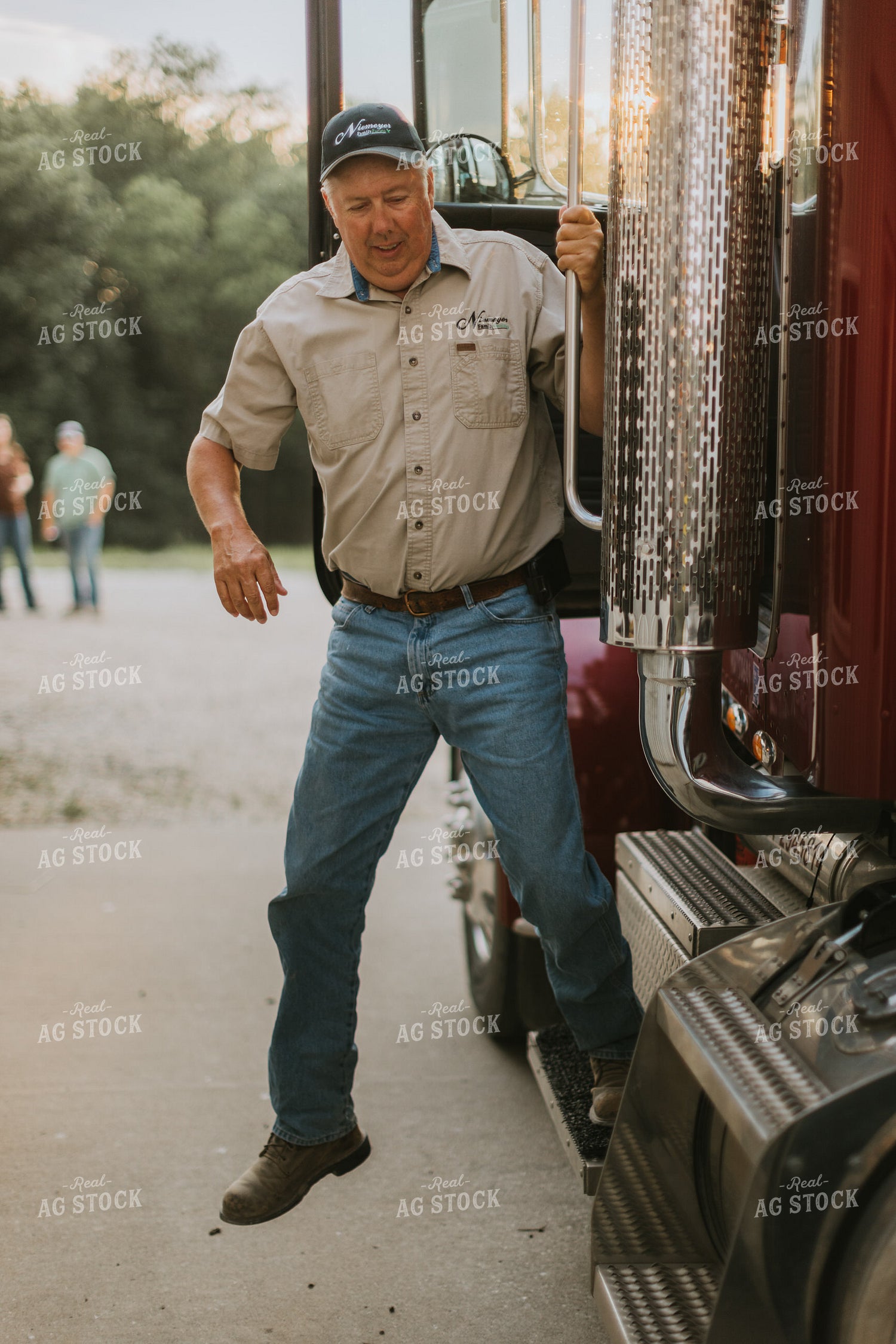 Farmer Climbing Out of Semi Truck 7786