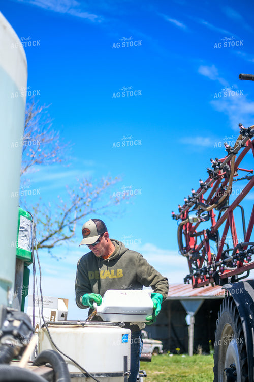 Farmer Mixing Chemicals for Self Propelled Sprayer 191064