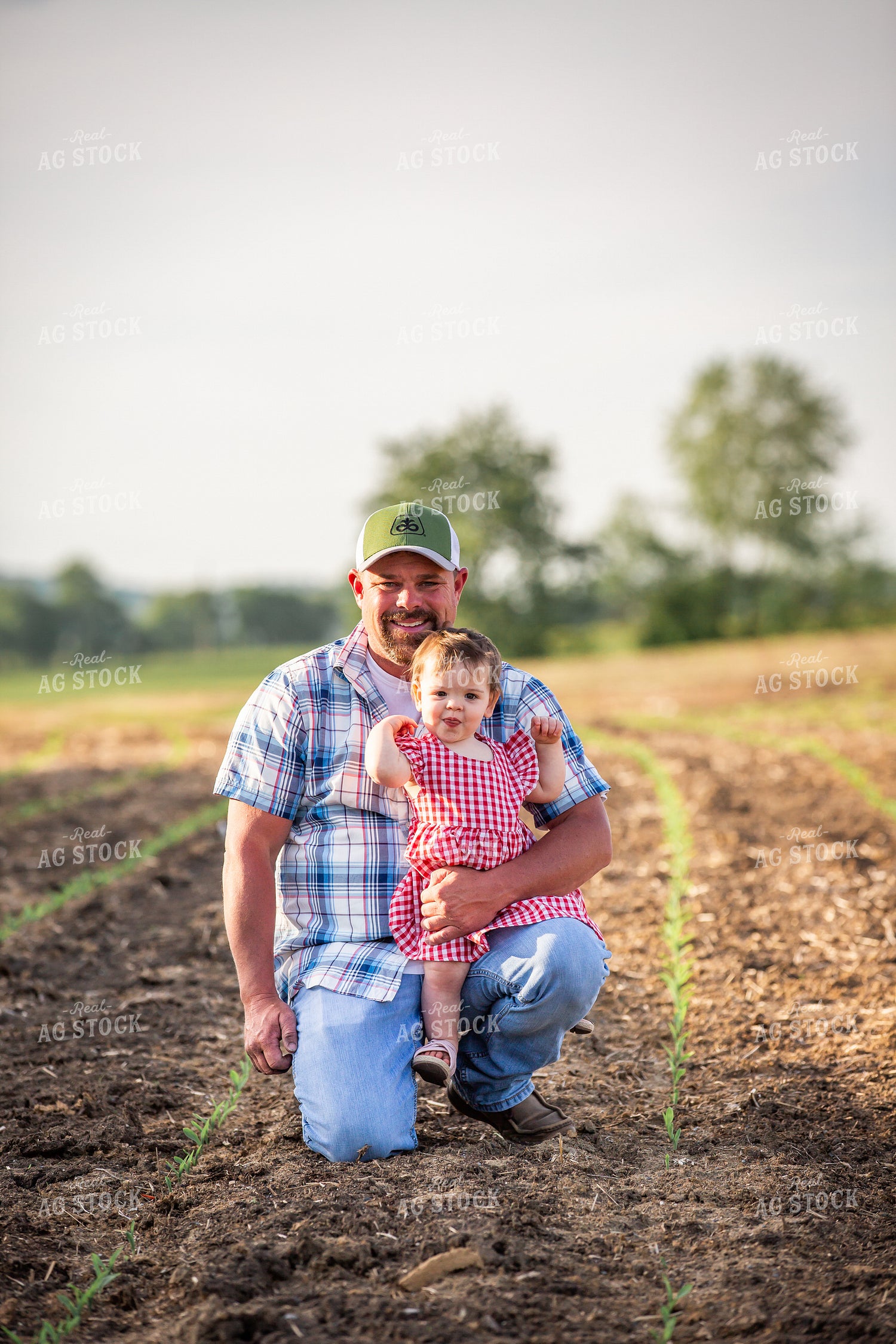 Farmer and Daughter Checking Corn 270020