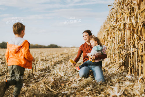 Female Farmer and Kids Playing in Cornfield 8520