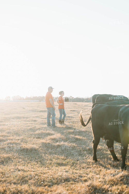 Male and Female Farmers in Pasture 125235