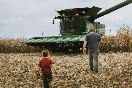 Farmer and Son Walking to Combine 8591