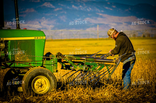 Farmer Working on Machinery 148016