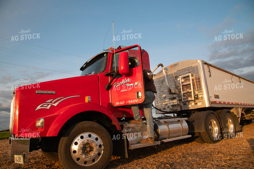 Farmer Climbing into Semi Cab 25689