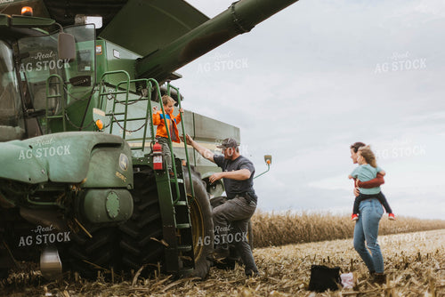 Farm Family Loading Kids into Combine 8566