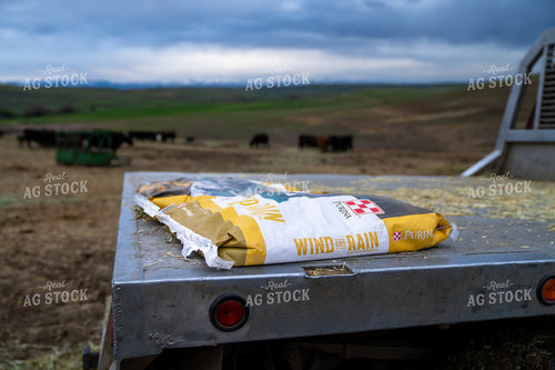 Bag of Cattle Mineral Feed on Truck Bed in Pastoral Field 65338