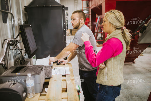 Man and Woman Running Seed Treater with Computer 5324