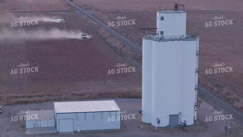 Aerial of Milo Harvest by Grain Elevator 239043