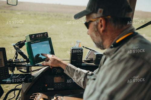 Farmer in Planter with Monitors 4091