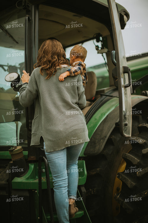 Farmer and Farm Kid Getting into Tractor 6665