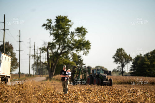 Farmer and Daughter Walking in Field 115538