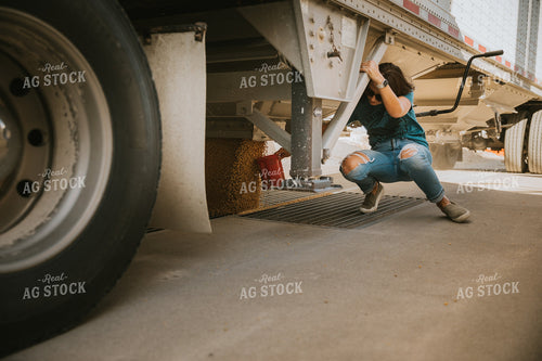 Farmer Collecting Sample from Semi 7032